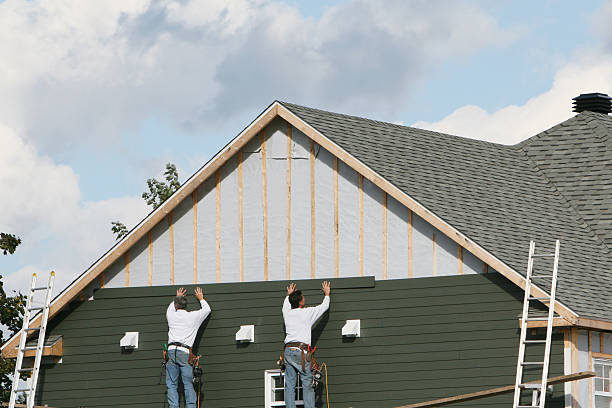 Professional Siding Installation technician working in Springs, NY